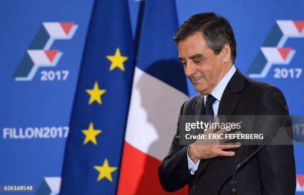 French member of Parliament and candidate for the right-wing primaries ahead of France's 2017 presidential elections, Francois Fillon gestures as he...