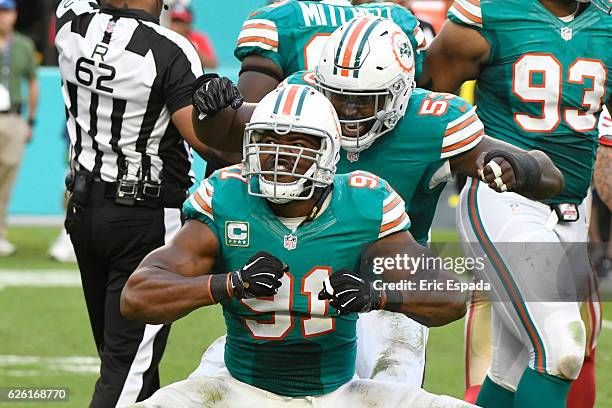 Cameron Wake of the Miami Dolphins celebrates after sacking Colin Kaepernick of the San Francisco 49ers during the 3rd quarter at Hard Rock Stadium...