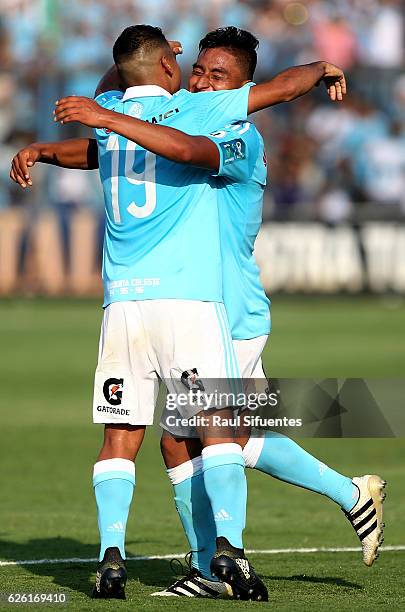 Alexis Rojas of Sporting Cristal celebrates with teammates after scoring his team's third goal of his team against FBC Melgar during a match between...