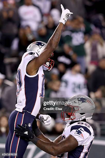 Malcolm Mitchell of the New England Patriots celebrates with Martellus Bennett after scoring a touchdown against the New York Jets during the second...