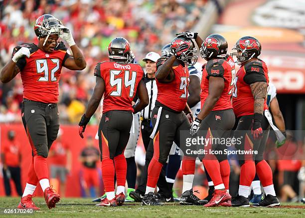 Tampa Bay Buccaneers Defensive End Robert Ayers is congratulated following a sack during an NFL football game between the Seattle Seahawks and the...
