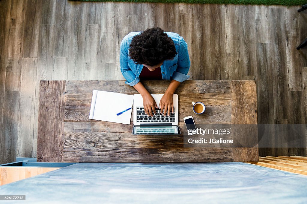 Overhead view of a woman using a computer