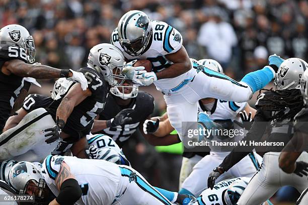 Jonathan Stewart of the Carolina Panthers dives short of the endzone against the Oakland Raiders during their NFL game on November 27, 2016 in...