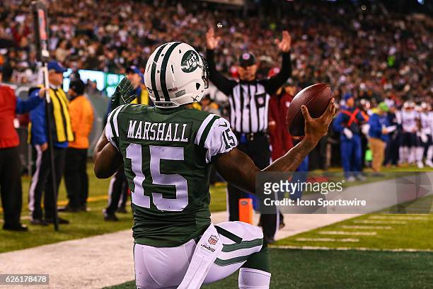 New York Jets wide receiver Brandon Marshall celebrates after he scores a touchdown during the first quarter of the National Football League game...