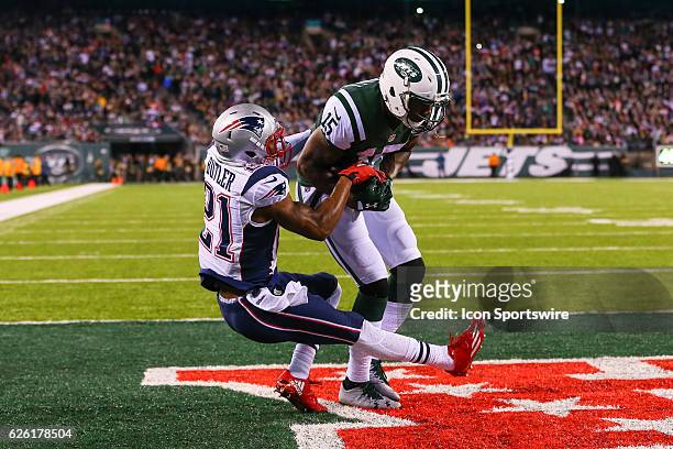 New York Jets wide receiver Brandon Marshall scores a touchdown over New England Patriots cornerback Malcolm Butler during the first quarter of the...