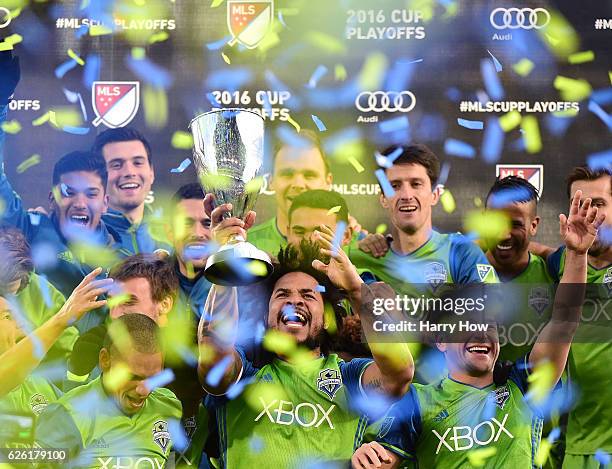 Roman Torres of Seattle Sounders holds up the MLS Western Conference trophy after a 1-0 victory over the Colorado Rapids at Dick's Sporting Goods...