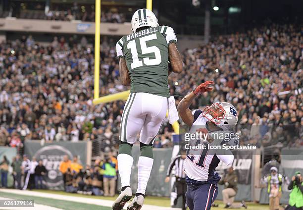 New York Jets Wide Receiver Brandon Marshall goes up over New England Patriots Cornerback Malcolm Butler for the touchdown catch during the NY Jets...