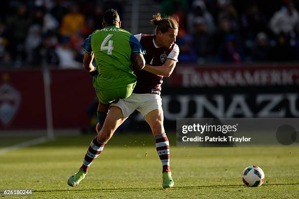 Marc Burch of Colorado Rapids and Tyrone Mears of Seattle Sounders collide during the second half. The Colorado Rapids hosted the Seattle Sounders in...