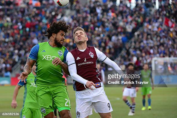Roman Torres of Seattle Sounders and Kevin Doyle of Colorado Rapids go up for a header during the first half. The Colorado Rapids hosted the Seattle...