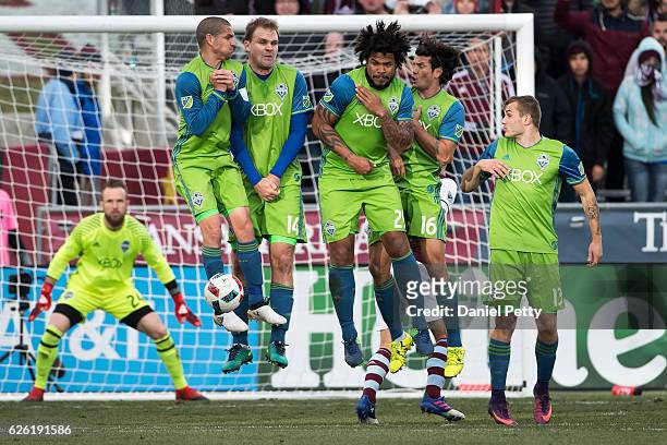 From left, Seattle Sounders players Osvaldo Alonso , Chad Marshall , Roman Torres , Nelson Haedo Valdez and Jordan Morris leap to block a free kick...