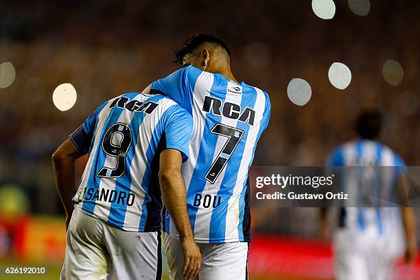 Lisandro Lopez of Racing Club celebrates with teammate Gustavo Bou after scoring the third goal of his team during a match between Racing Club and...