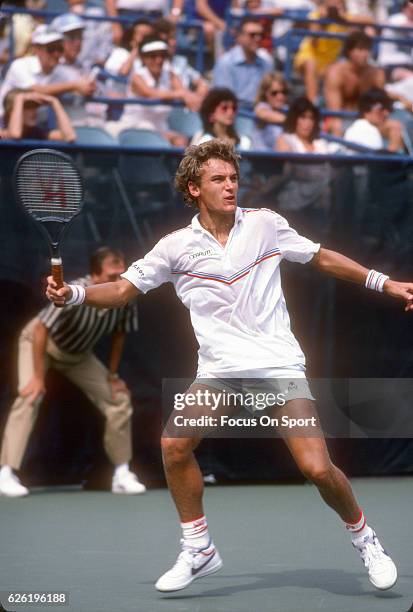 Mats Wilander of Sweden hits a return during the Men's 1983 US Open Tennis Championships circa 1983 at the USTA National Tennis Center in the Queens...