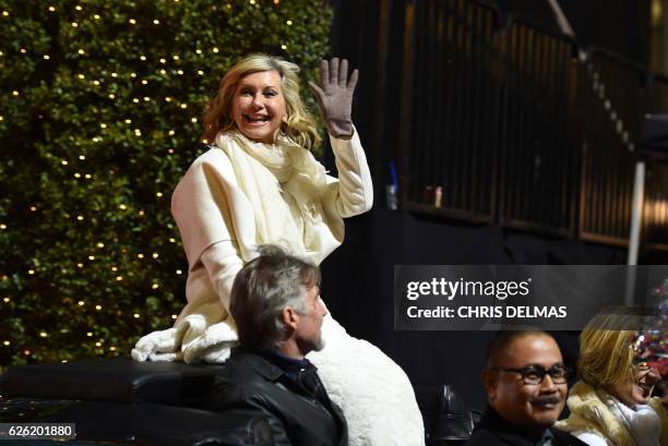 Olivia Newton John, grand marshall, waves during the 85th annual Hollywood Christmas Parade on Hollywood Boulevard in Hollywood, on November 27, 2016.