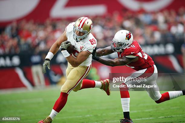 Vance McDonald of the San Francisco 49ers runs after making a reception during the game against the Arizona Cardinals at the University of Phoenix...