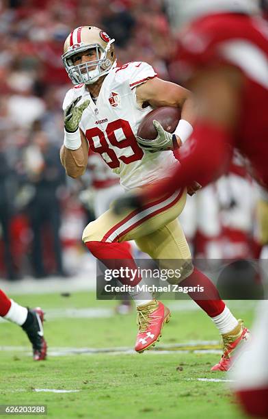 Vance McDonald of the San Francisco 49ers runs after making a reception during the game against the Arizona Cardinals at the University of Phoenix...