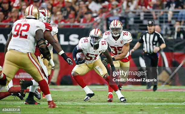 Gerald Hodges of the San Francisco 49ers runs after recovering a fumble during the game against the Arizona Cardinals at the University of Phoenix...