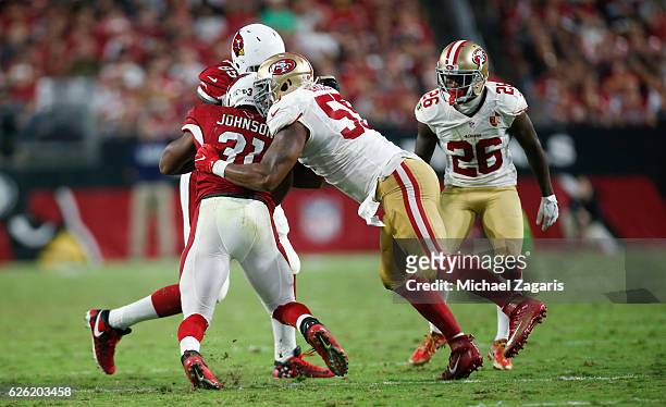Ahmad Brooks of the San Francisco 49ers tackles David Johnson of the Arizona Cardinals during the game at the University of Phoenix Stadium on...