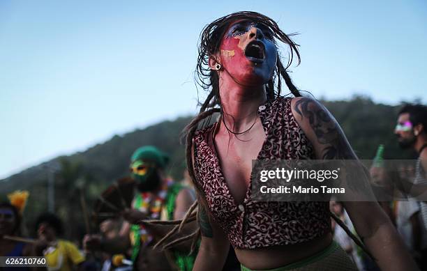 Performers dance during the 2016 Honk! Rio Festival, a celebration of brass bands, on November 27, 2016 in Rio de Janeiro, Brazil. The four-day...