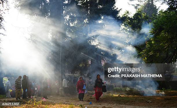 Nepalese Hindu devotees offer various plant seeds during the Balachaturdashi festival at the Pashupatinath temple in Kathmandu on November 28, 2016....