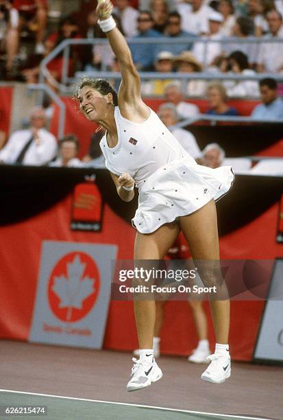 Monica Seles of Yugoslavia serves during a women's singles match at the Du Maurier Canadian Open circa 1995 at the Jarry Stadium in Montreal, Quebec,...