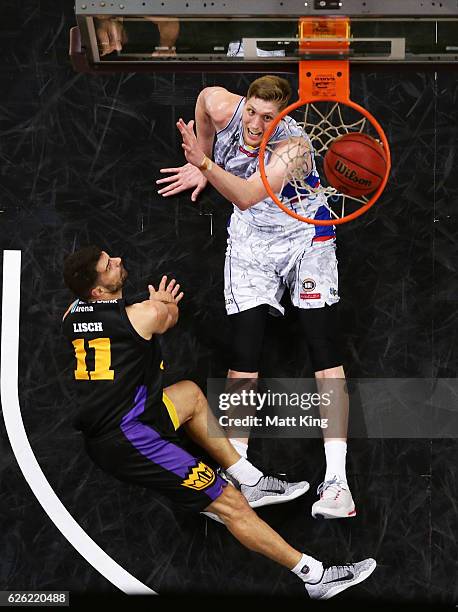 Kevin Lisch of the Kings is fouled by Matt Hodgson of the 36ers during the round eight NBL match between the Sydney Kings and the Adelaide 36ers at...