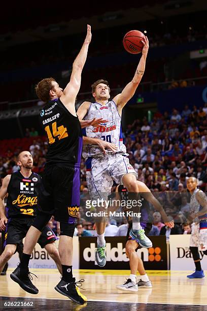 Nathan Sobey of the 36ers drives to the basket under pressure from Tom Garlepp of the Kings during the round eight NBL match between the Sydney Kings...