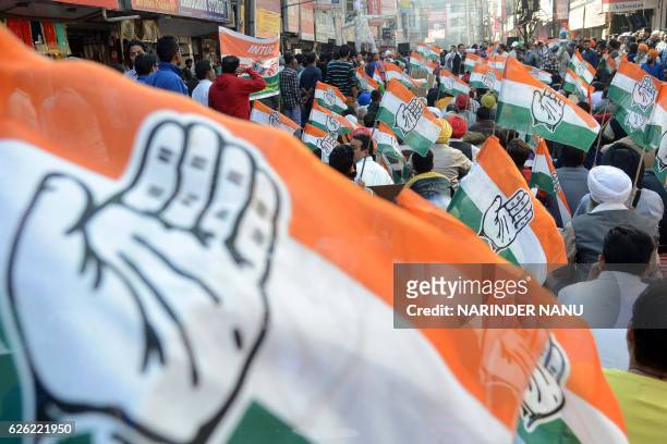 Indian members of the Congress party listen to a speech during a protest against demonetisation in Amritsar on November 28, 2016. - After a week of...
