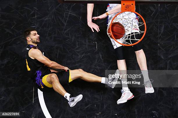 Kevin Lisch of the Kings is fouled by Matt Hodgson of the 36ers during the round eight NBL match between the Sydney Kings and the Adelaide 36ers at...