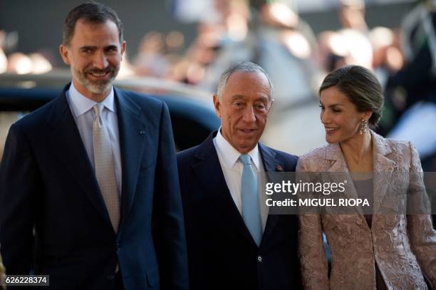 Portugal's President Marcelo Rebelo de Sousa welcomes Spain's king Felipe VI and his wife queen Letizia after their arrival in Porto, on November 28,...