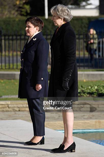 British Prime Minister Theresa May and her Polish counterpart Beata Szydlo stand as the Last Post is played during their visit to the Polish War...