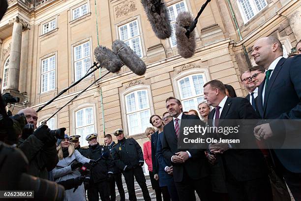 Prime Minister Lars Lokke Rasmussen with his new team of ministers meet the press outside Amalienborg after having presented his new coalition...