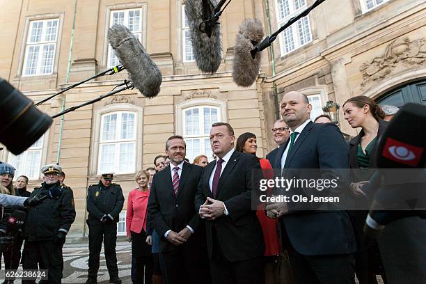 Prime Minister Lars Lokke Rasmussen with his new team of ministers meet the press outside Amalienborg after having presented his new coalition...