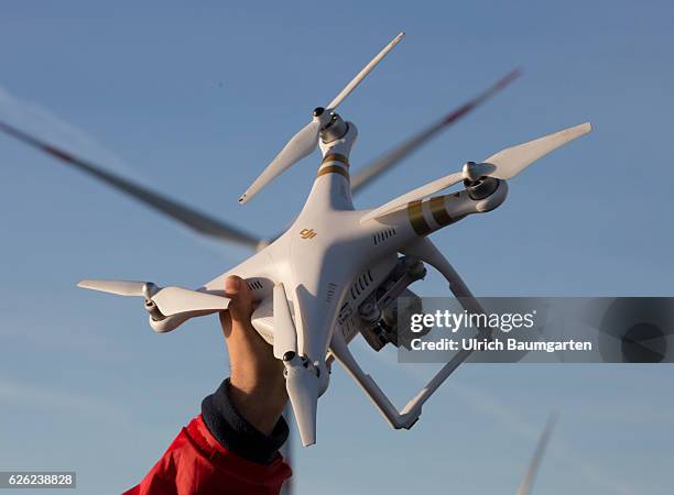 Wind turbines in the offshore wind farm Amrumbank West of the E.ON SE and a photo drone.