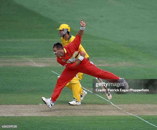 Heath Streak bowling for Zimbabwe watched by Ricky Ponting of Australia during the World Cup Super Six match between Australia and Zimbabwe at Lord's...