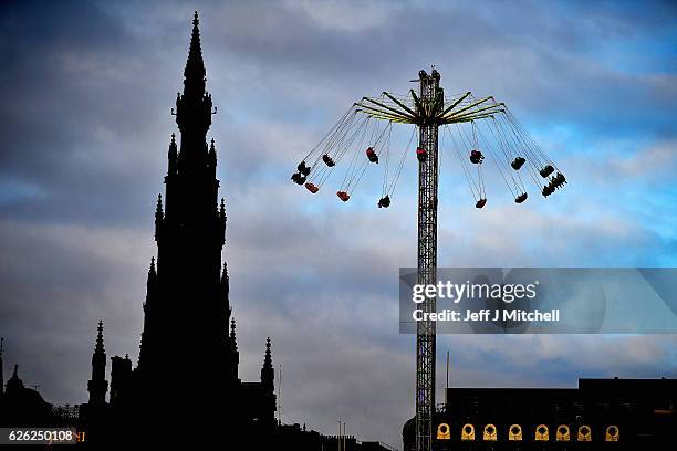 Members of the public enjoy a ride on the star flyer on November 28, 2016 in Edinburgh, Scotland. The star flyer is one of a number of rides situated...