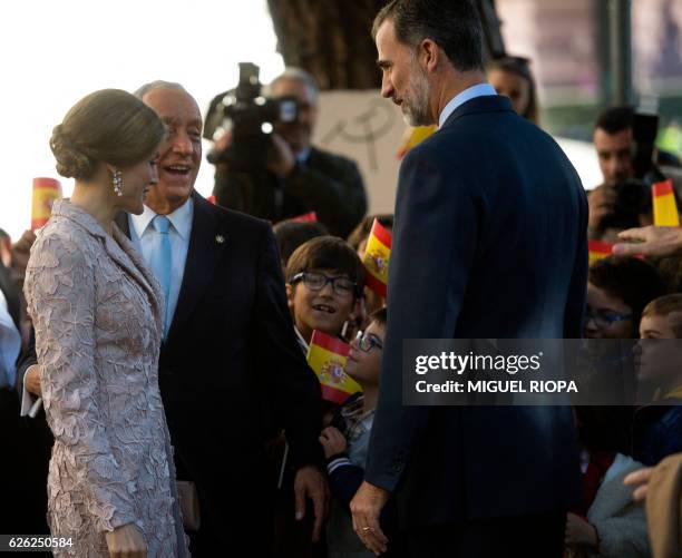 Spanish King Felipe VI , Queen Letizia and Portugal's President Marcelo Rebelo de Sousa speak with some children on the first day of the Spanish...