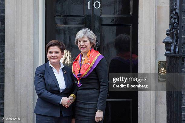 Theresa May, U.K.'s prime minister, right, greets Beata Szydlo, Poland's prime minister, outside 10 Downing Street in London, U.K., on Monday, Nov....