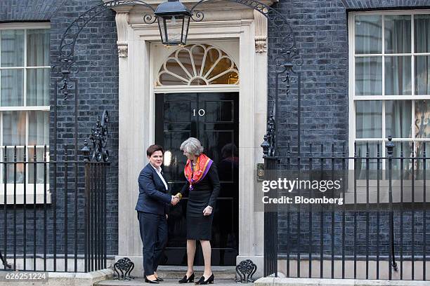 Theresa May, U.K.'s prime minister, right, greets Beata Szydlo, Poland's prime minister, outside 10 Downing Street in London, U.K., on Monday, Nov....