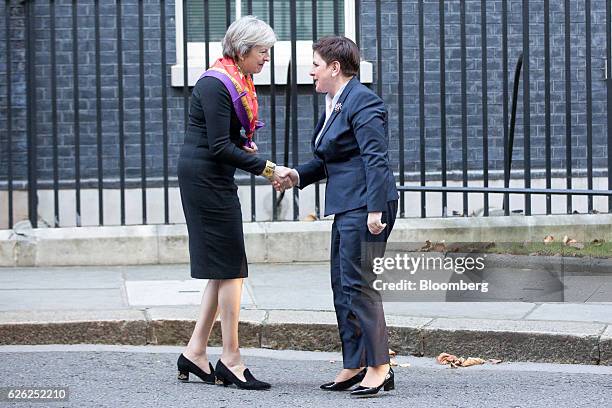 Theresa May, U.K.'s prime minister, left, greets Beata Szydlo, Poland's prime minister, in Downing Street in London, U.K., on Monday, Nov. 28, 2016....