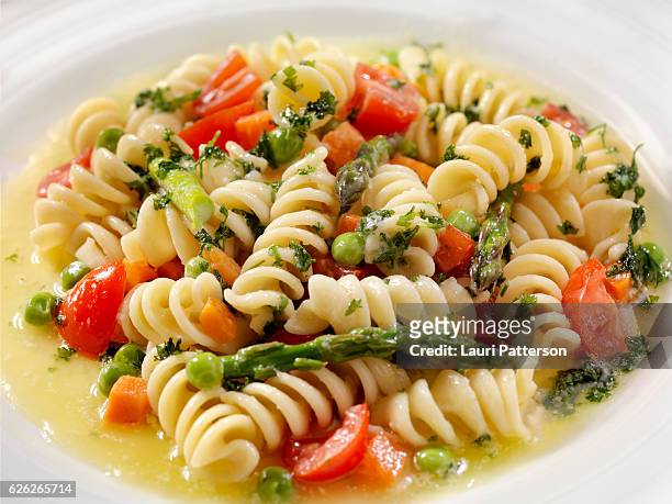 rotini primavera in a browned butter and garlic sauce - primavera stock pictures, royalty-free photos & images