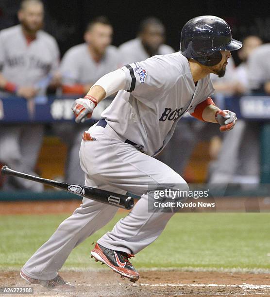 United States - Boston Red Sox outfielder Shane Victorino hits an infield single to shortstop during the seventh inning of Game 4 of the American...