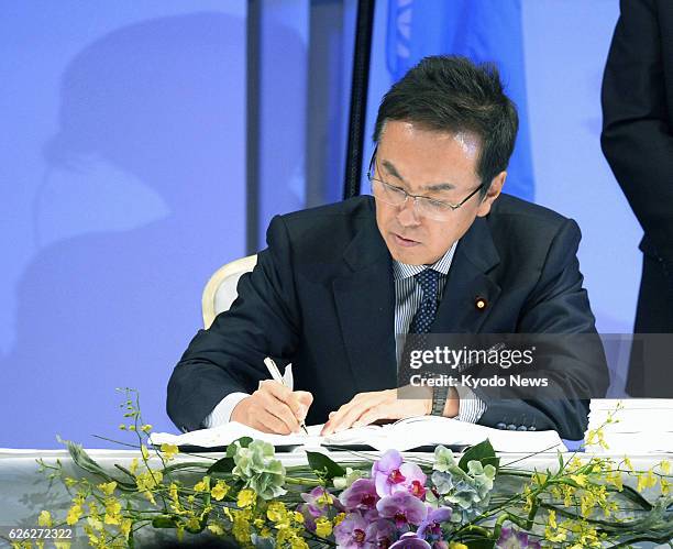Japan - Japanese Environment Minister Nobuteru Ishihara signs the landmark "Minamata Convention on Mercury" after chairing an international...