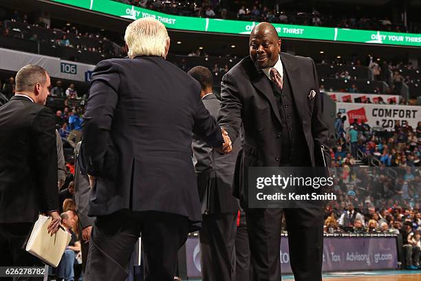 Patrick Ewing of the Charlotte Hornets shakes hands before the game against the New York Knicks on November 26, 2016 at Spectrum Center in Charlotte,...