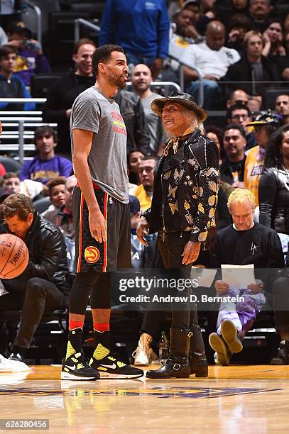 Thabo Sefolosha of the Atlanta Hawks talks to NBA Superfan, James Goldstein before the game against the Los Angeles Lakers on November 27, 2016 at...