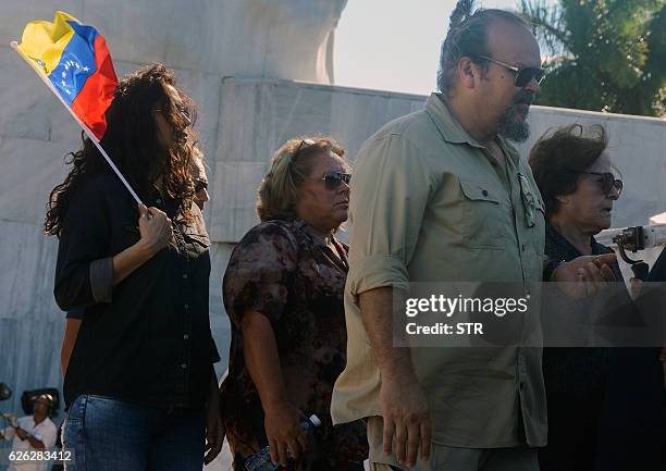 Legendary guerrilla leader Ernesto "Che" Guevara's widow Aleida March , his son Camilo Guevara and her daughter Aleida Guevara , pay their last...