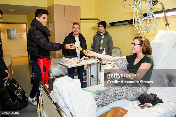 Marc Bartra, Felix Passlack, Mario Goetze is seen during the annual visit of Borussia Dortmund at the children's hospital on November 28, 2016 in...