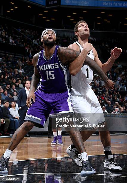 DeMarcus Cousins of the Sacramento Kings boxes out Brook Lopez of the Brooklyn Nets on November 27, 2016 at Barclays Center in Brooklyn, NY. NOTE TO...
