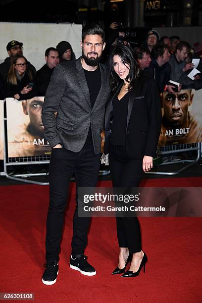 Footballer Olivier Giroud and wife Jennifer Giroud attend the World Premiere of "I Am Bolt" at Odeon Leicester Square on November 28, 2016 in London,...