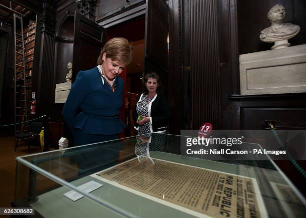Scottish First Minister Nicola Sturgeon and librarian Anne-Marie Diffley look at an original copy of the Irish Proclamation of Independence in a...