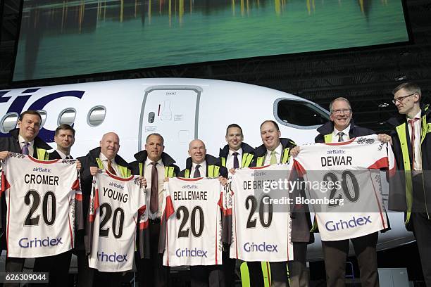 Fred Cromer, president of commercial aircraft at Bombardier Inc., from left, Todd Young, vice president of services and support at Bombardier Inc.,...